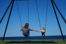 mom and daughter swing on the beach Custom