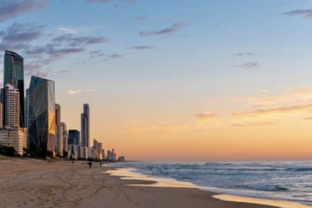 Landscape of Gold Coast beach at sunrise, with buildings