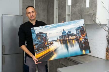 Photo canvas print. A man holding a photography with gallery wrap