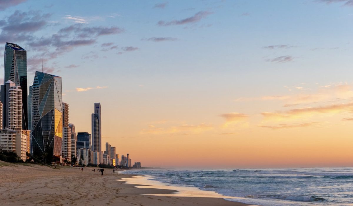 Landscape of Gold Coast beach at sunrise, with buildings